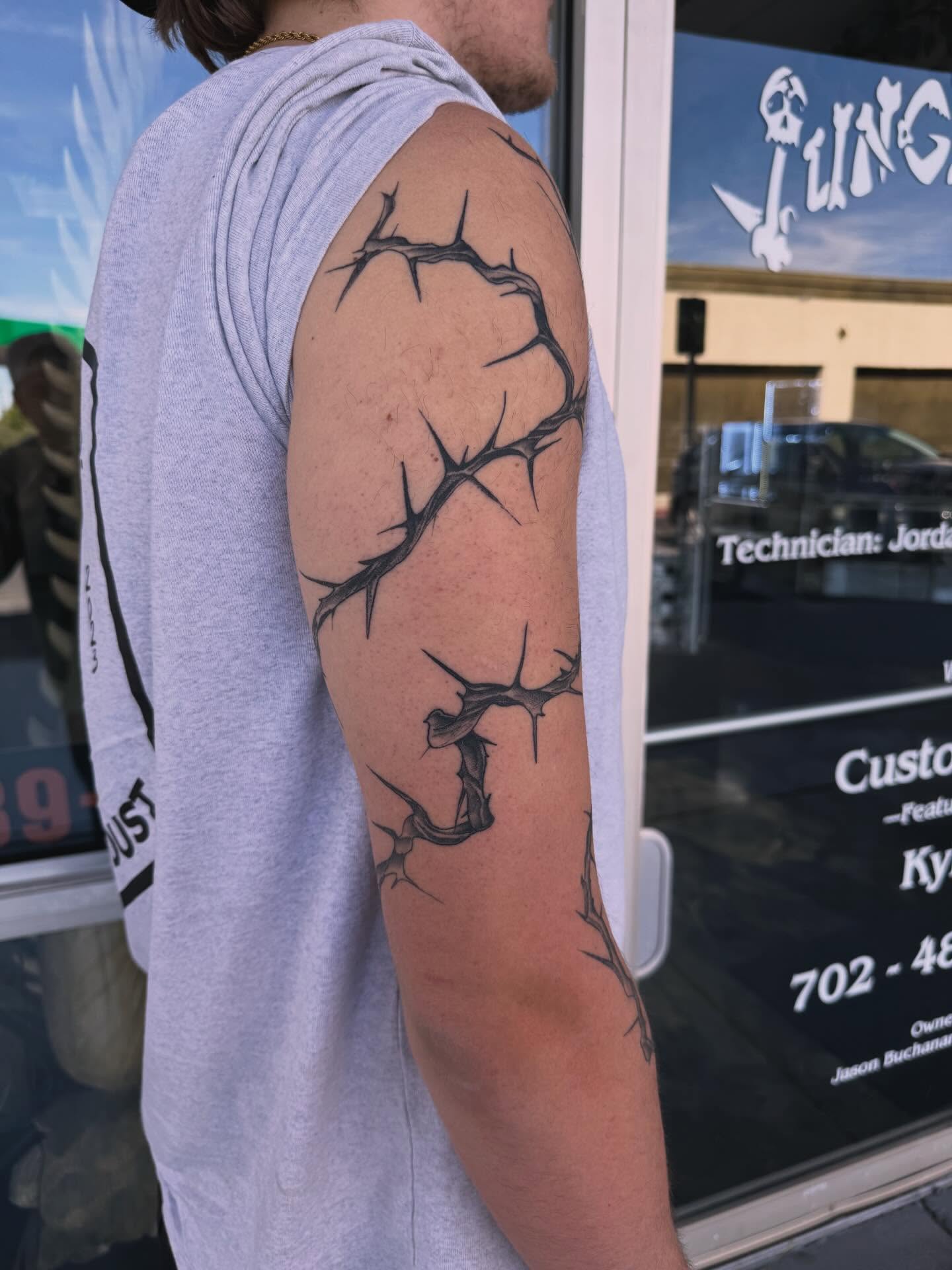 Thorn crown black and grey tattoo on the upper arm by Kyle Haitch, Las Vegas, Nevada