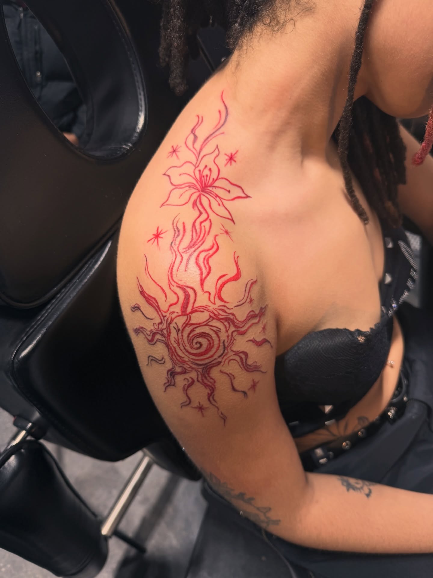 Sun and flower new school tattoo on the shoulder by CandiCoatedInk