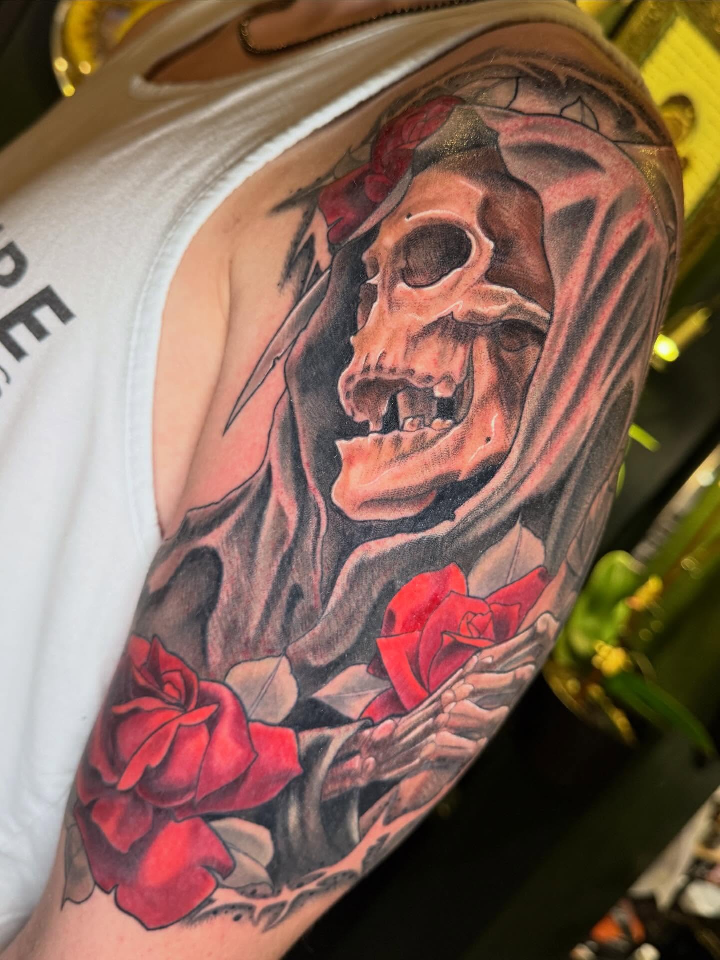 Skull with roses realism tattoo on the forearm by Em ✨PA Tattooer