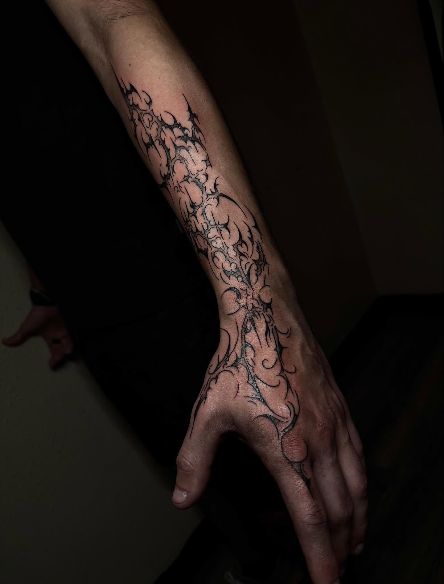 Tribal design tribal tattoo on the forearm by Grace L
