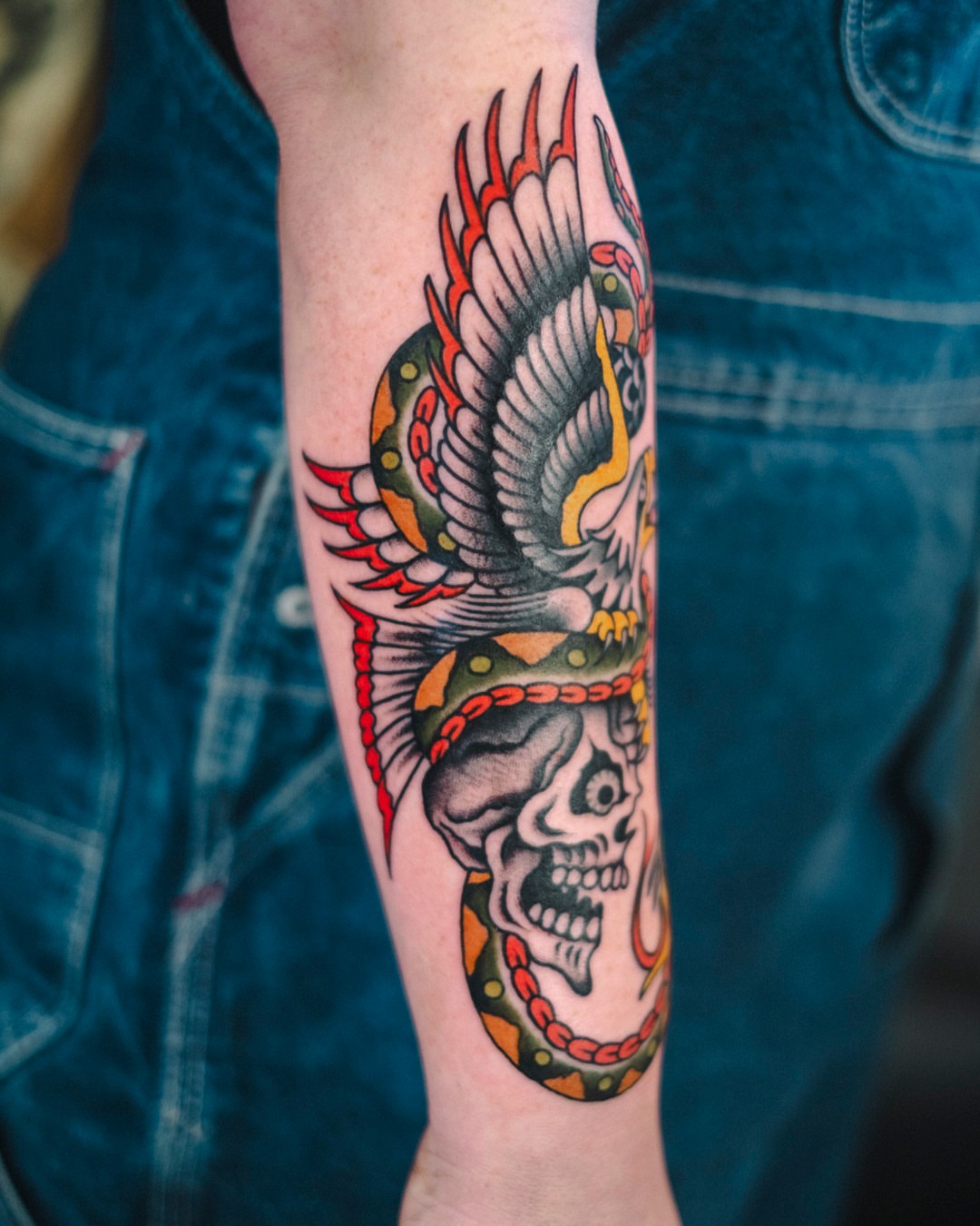 Skull with wings American traditional tattoo on the forearm by Dan Gilsdorf, Portland, Oregon