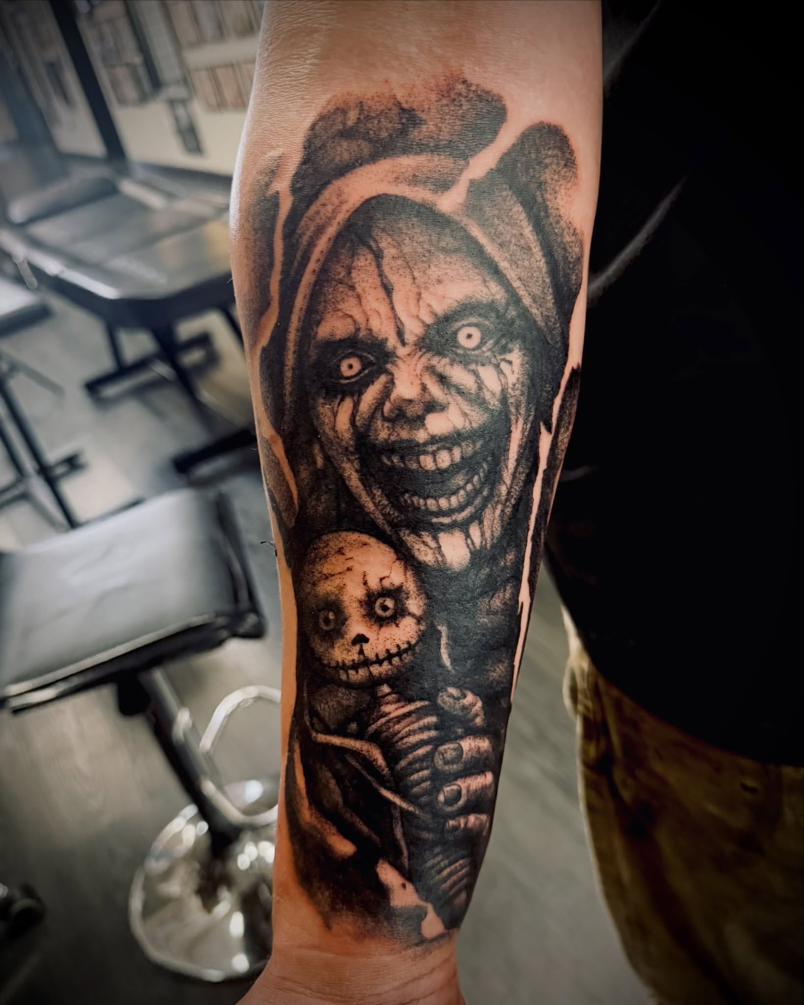 Clown and skeleton realism tattoo on the forearm by IX