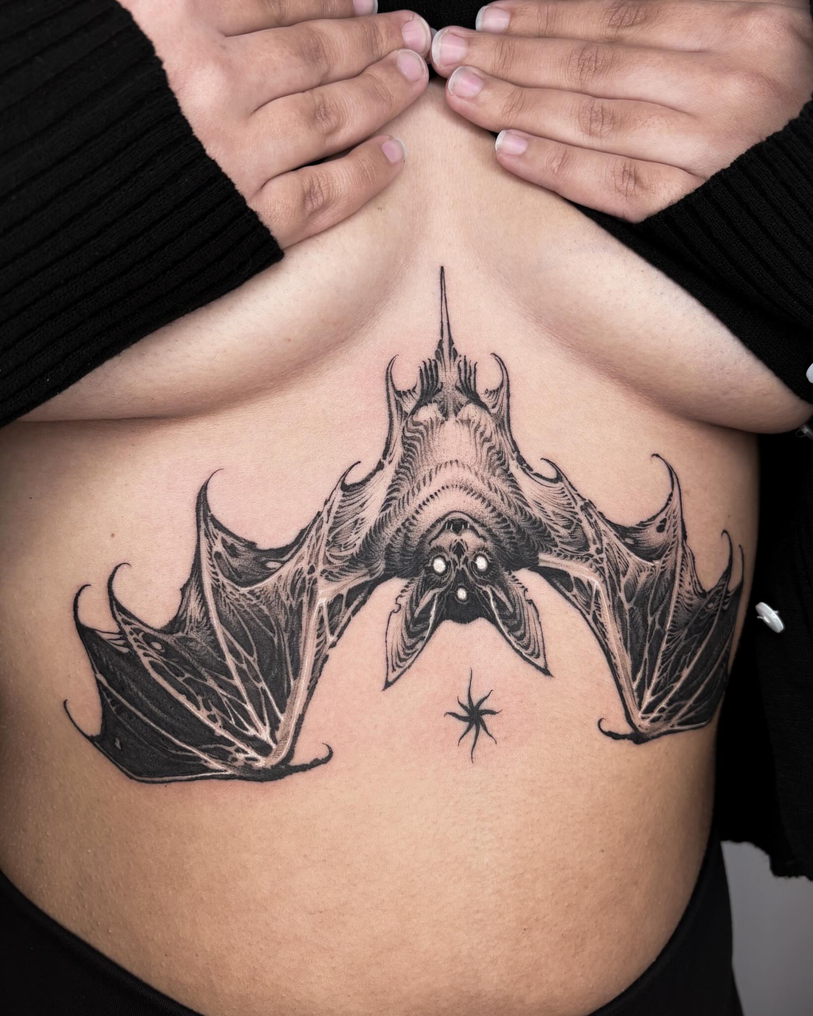 Bat geometric tattoo on the ribs by 우레