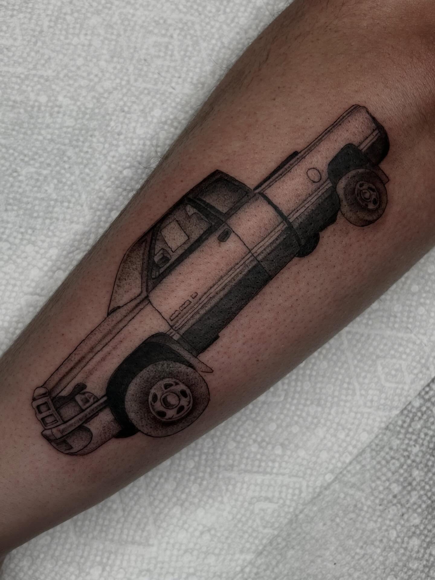 Truck dotwork tattoo on the forearm by Olivia Fox