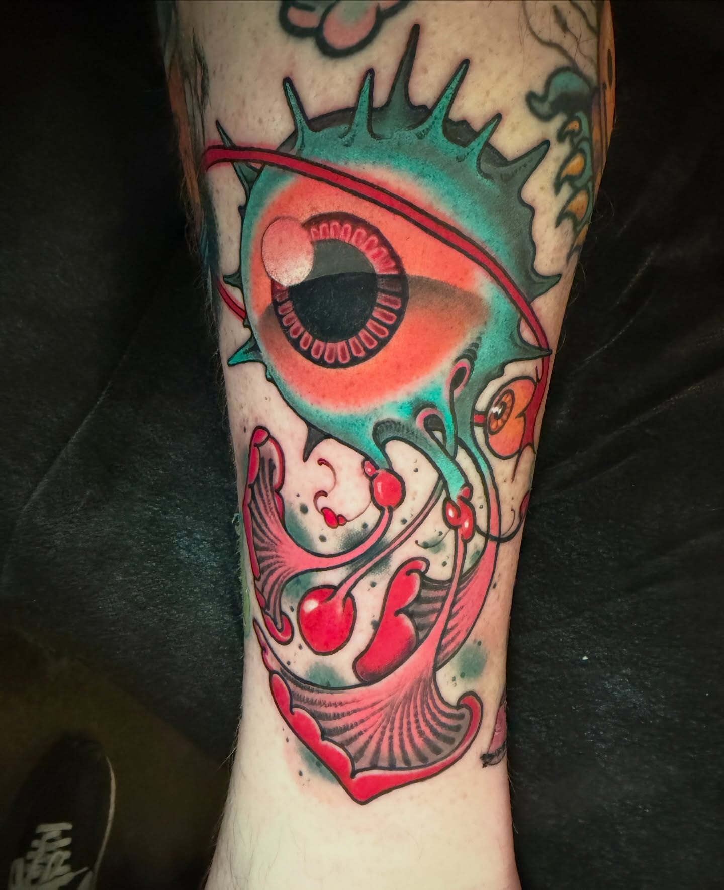 Eye and floral American traditional tattoo on the forearm by JoshUA Bowers, Des Moines, Iowa