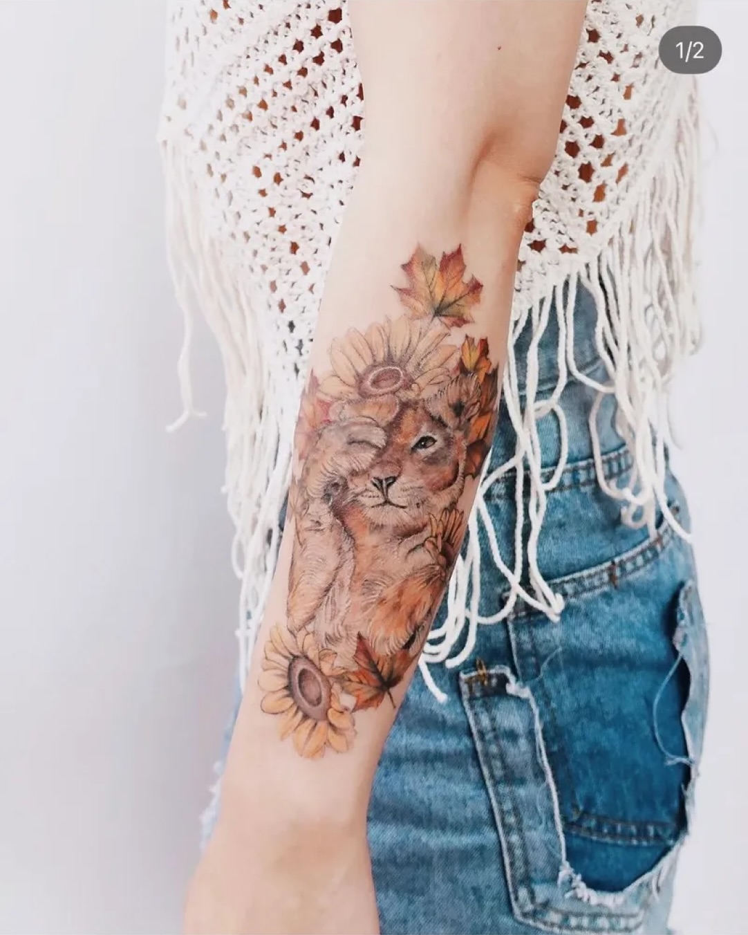 Lion with sunflower crown realism tattoo on the forearm by @michaelryan_tattoo