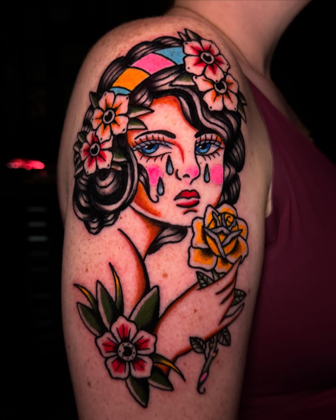 Woman with flowers American traditional tattoo on the shoulder by @michaelryan_tattoo