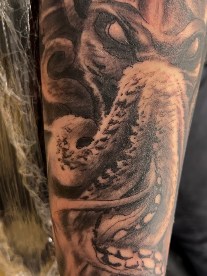 Tattoo by @strikt — black_and_grey, realism