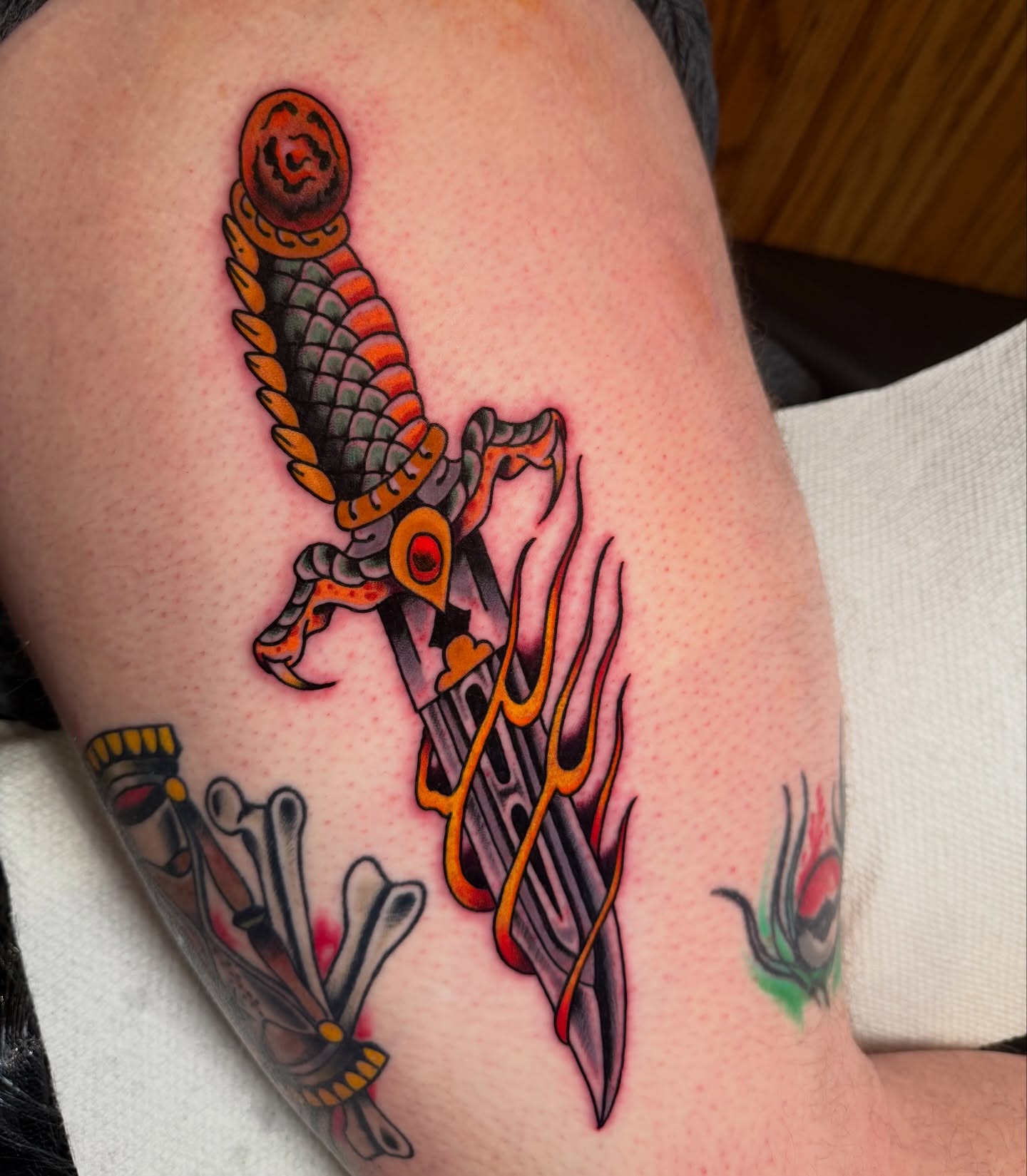 Bird and dagger American traditional tattoo on the thigh by πππ’π―π’π¨ πππΆπ©π¬π―π, Manchester, New Hampshire