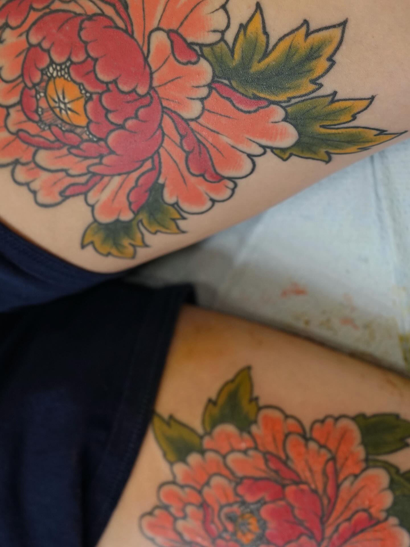 Peony American traditional tattoo on the thigh by Tyler Harrington