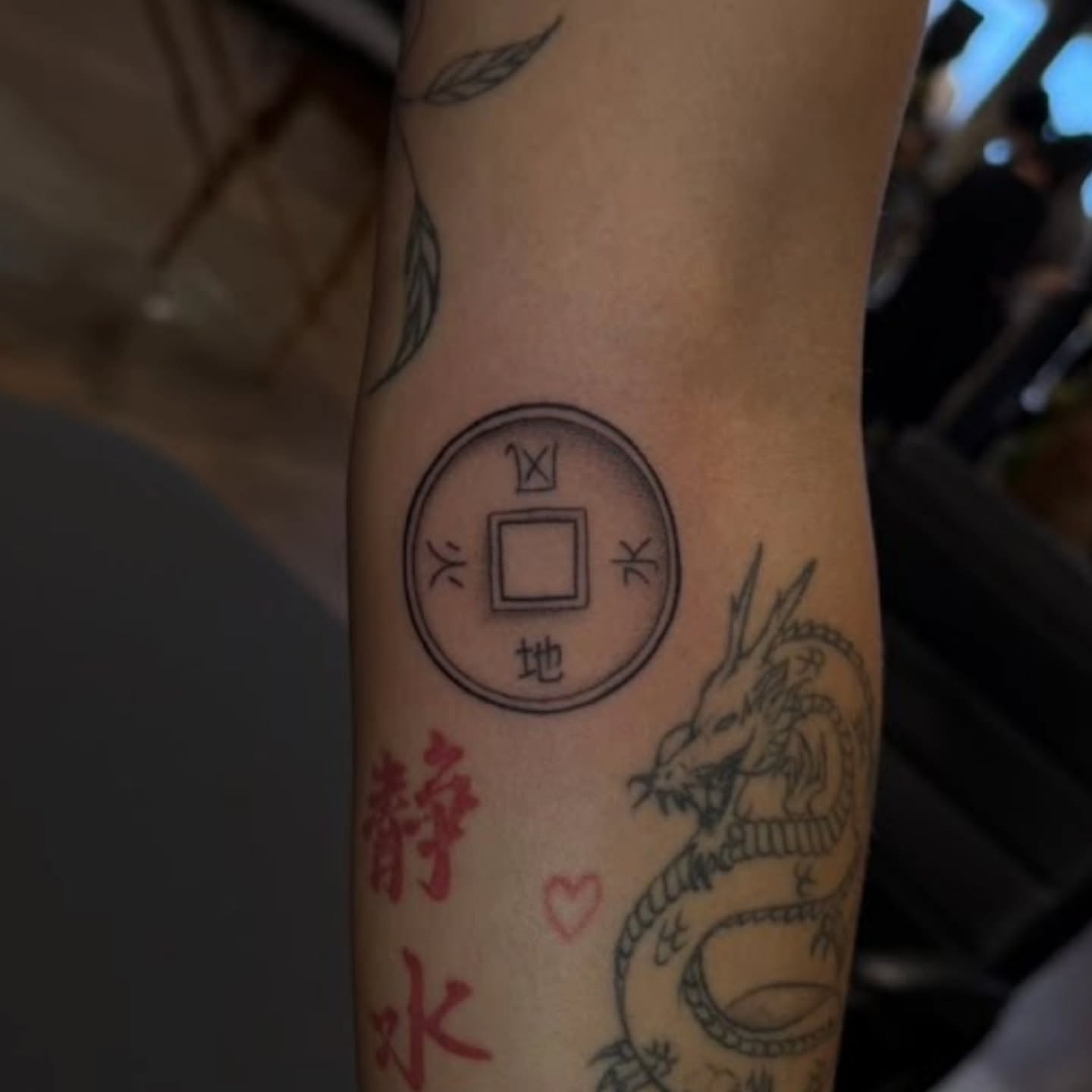 Dragon and Chinese characters black and grey tattoo on the forearm by Trista Bettfreund (Birdy)