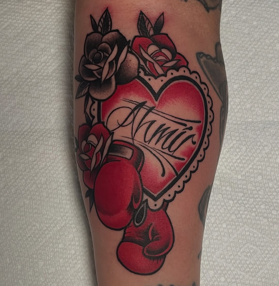Heart with name and boxing gloves neo-traditional tattoo on the forearm by Mike D