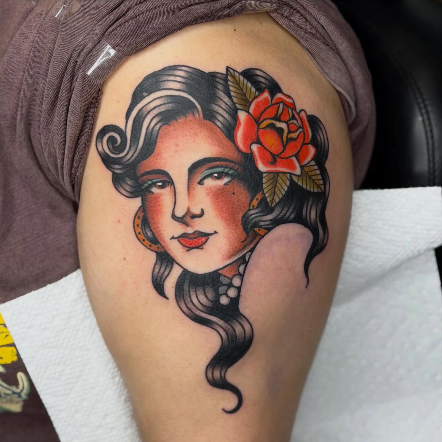 Woman with flower American traditional tattoo on the shoulder by Jenna Szerszen-Wynn ๐