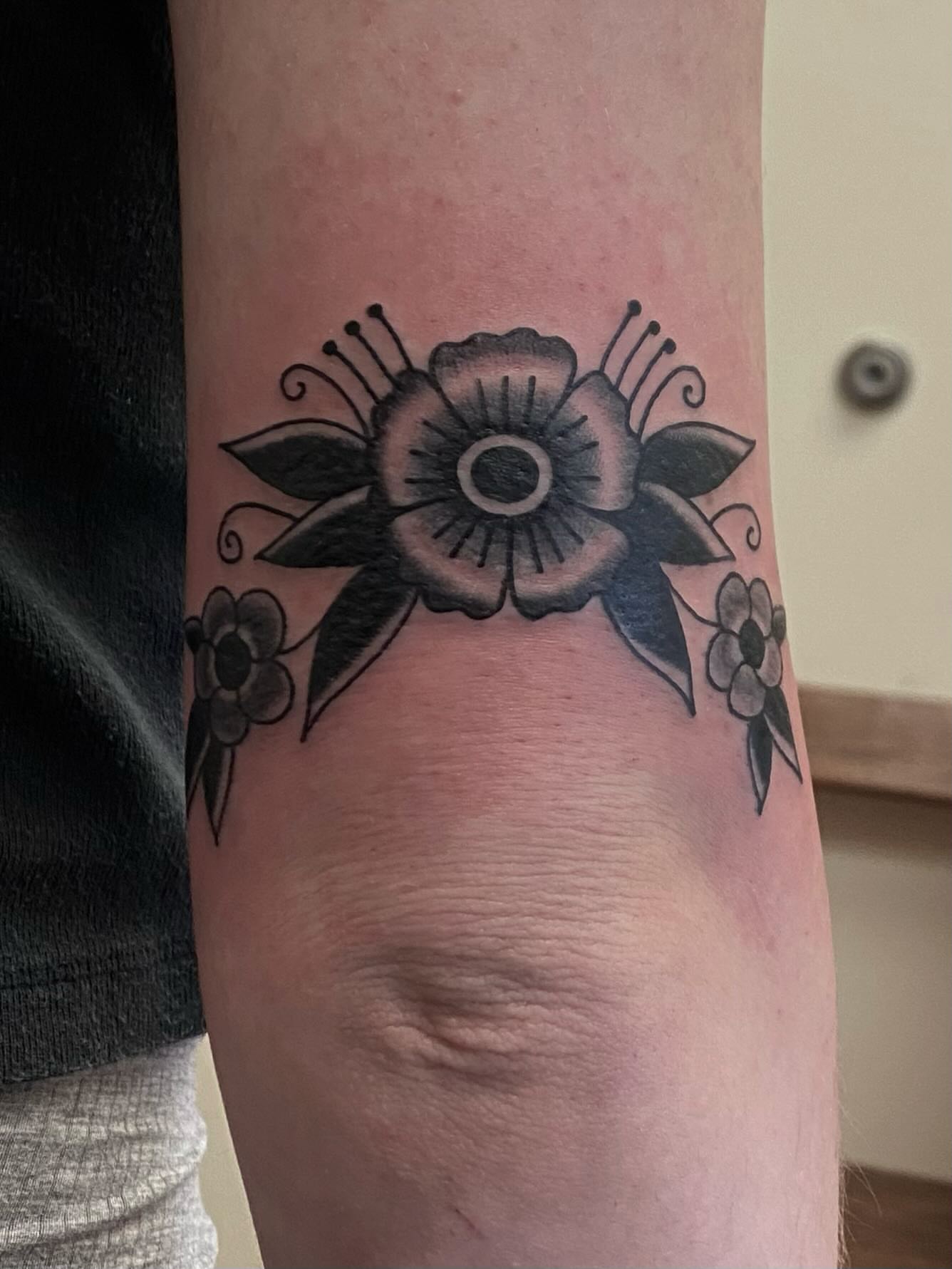 Flower American traditional tattoo on the forearm by Abby Rose Estes