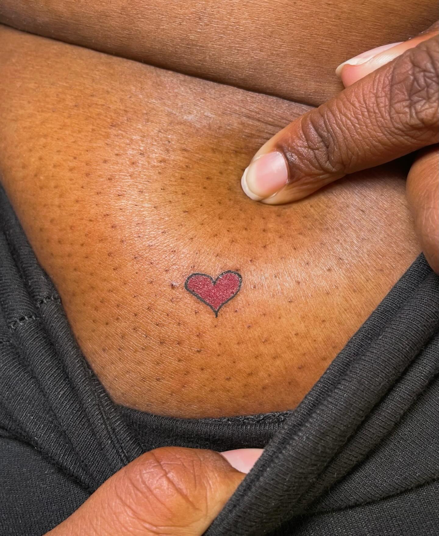 Heart dotwork tattoo on the chest by 𝚃𝙰𝚃𝚃𝙾𝙾 𝙰𝚁𝚃𝙸𝚂𝚃, Charlotte, North Carolina