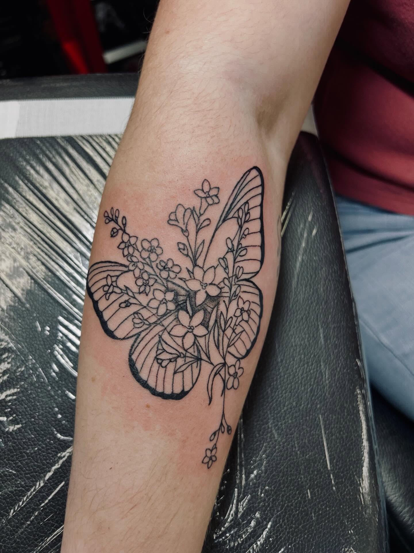 Butterfly black and grey tattoo on the forearm by Bjorn Bjornstad, Dubuque, Iowa