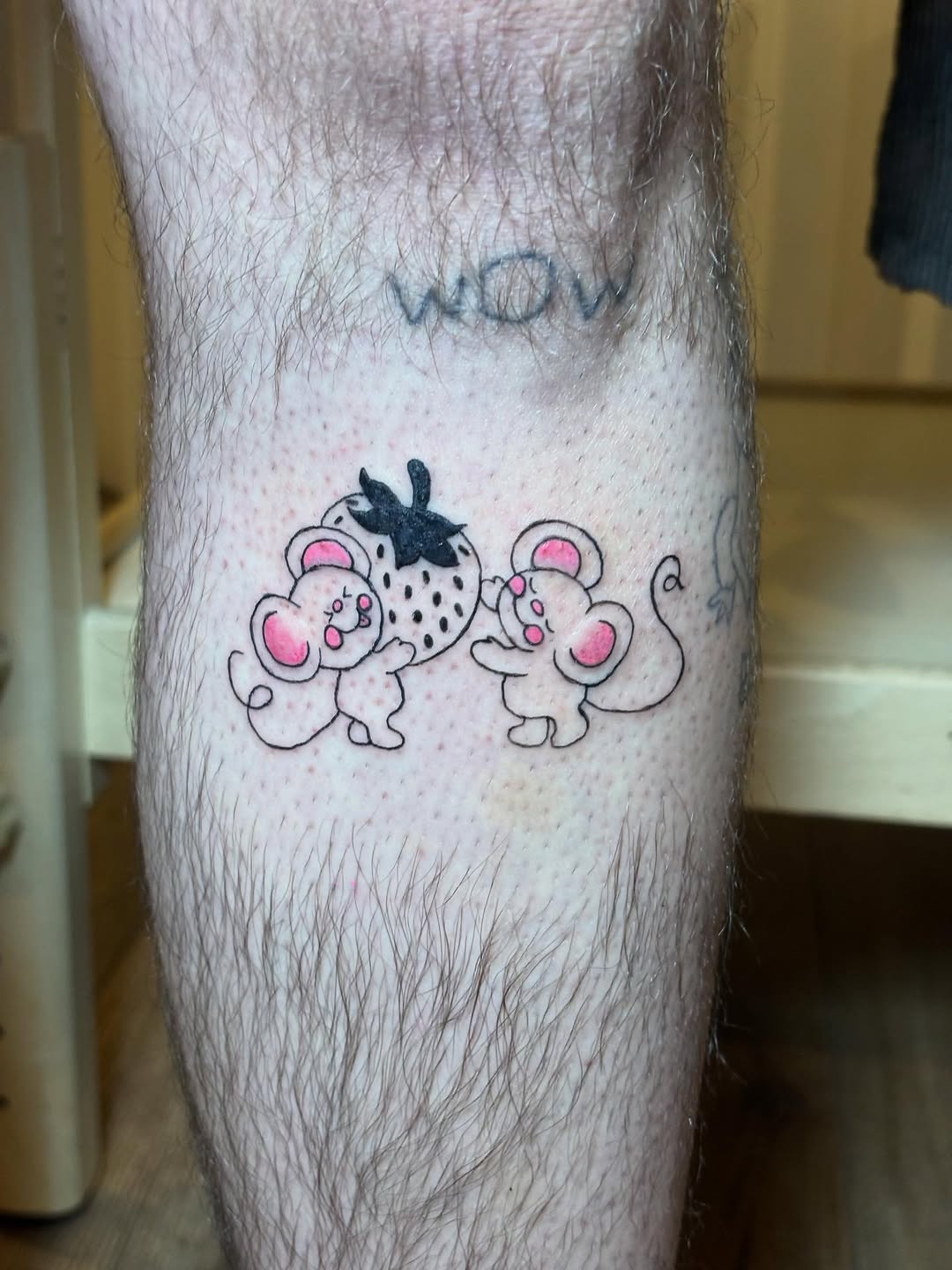 Two mice and a strawberry ignorant tattoo on the leg by riley