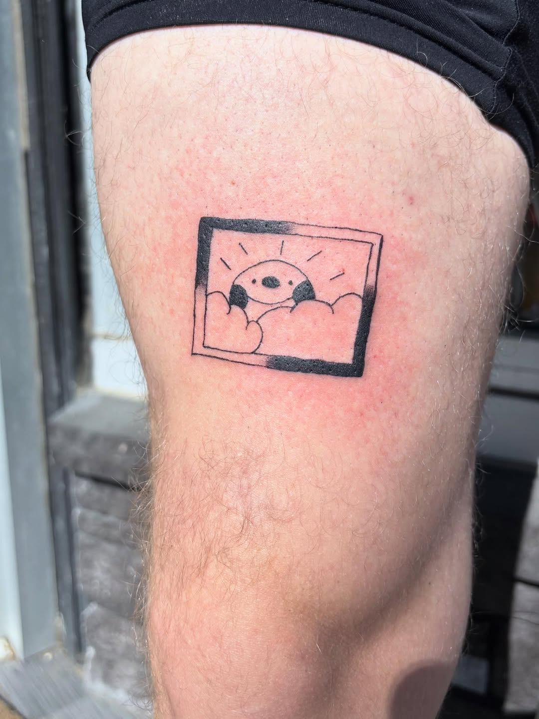 Character in clouds new school tattoo on the thigh by riley