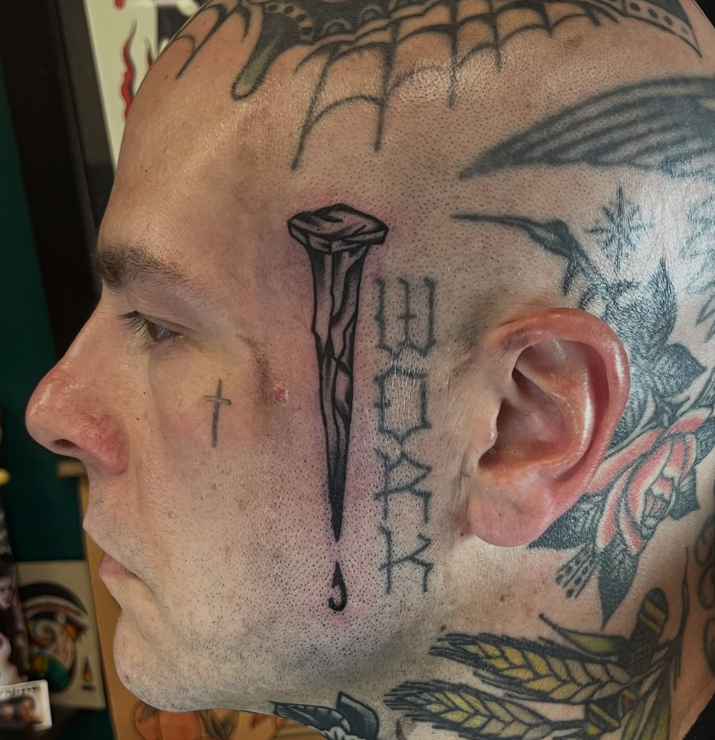 Nail and cross black and grey tattoo on the head by August B., Renton, Washington
