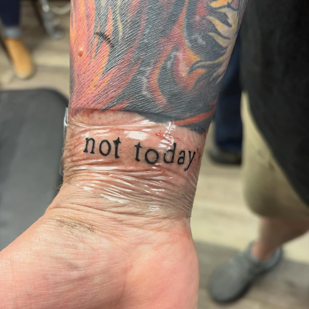 Not today text minimalist tattoo on the forearm by Madison