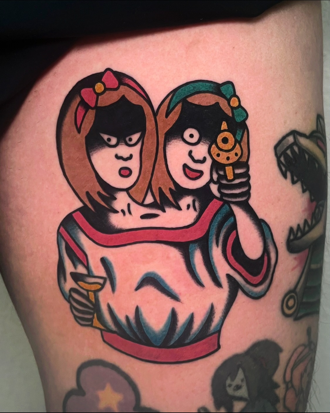 Two girls American traditional tattoo on the thigh by Tattoo Dust ☻ Los Angeles