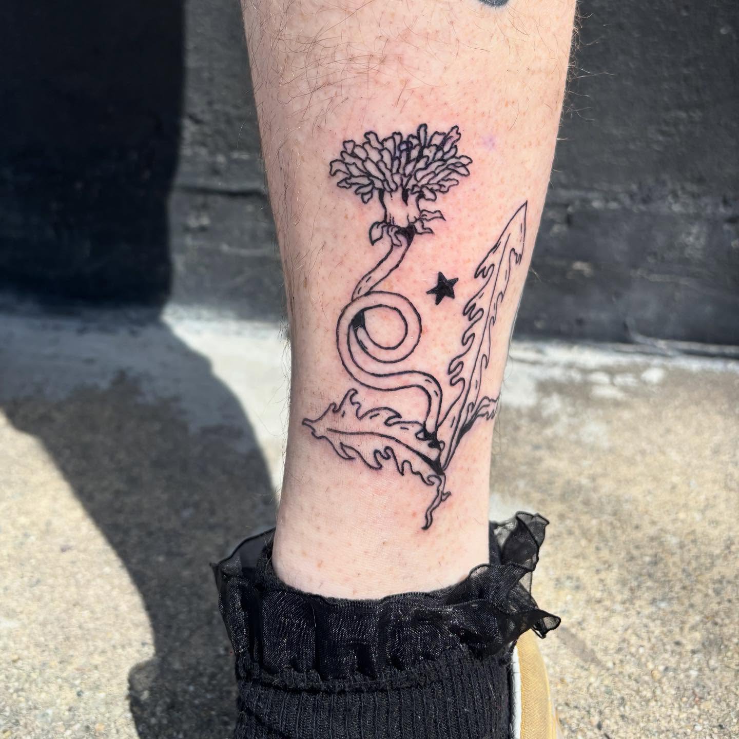 Flower and snake black and grey tattoo on the forearm by Hiro Robinson