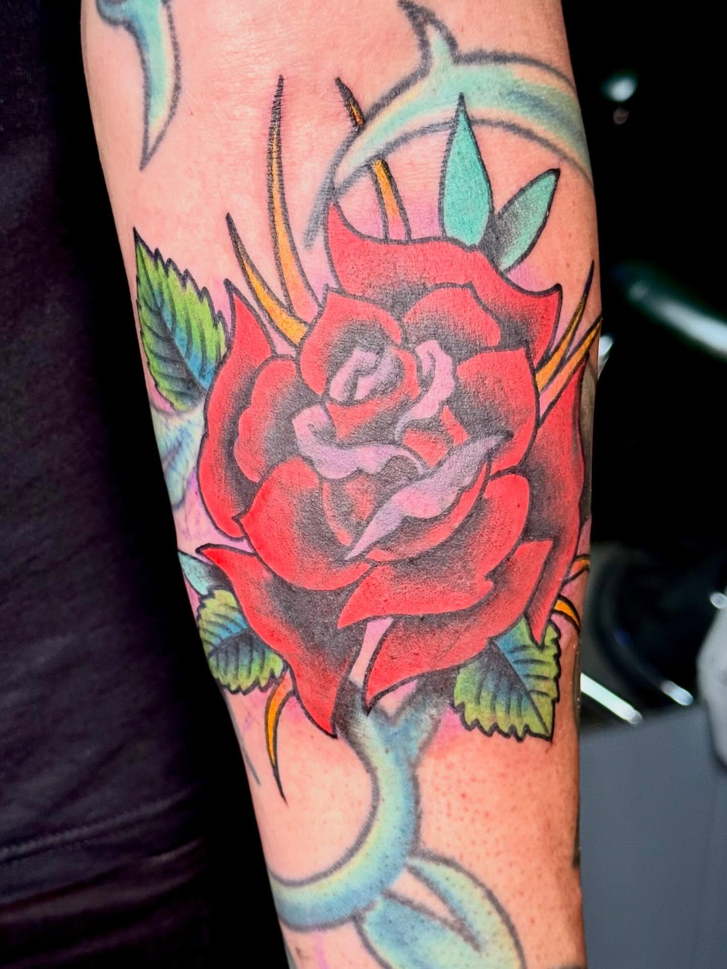 Red rose American traditional tattoo on the forearm by KevinBetsch