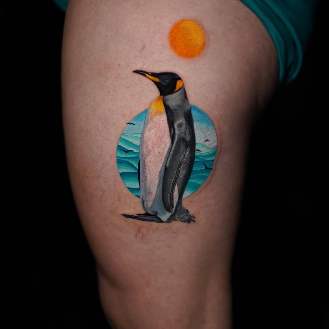 King penguin realism tattoo on the thigh by Davier Del Castillo