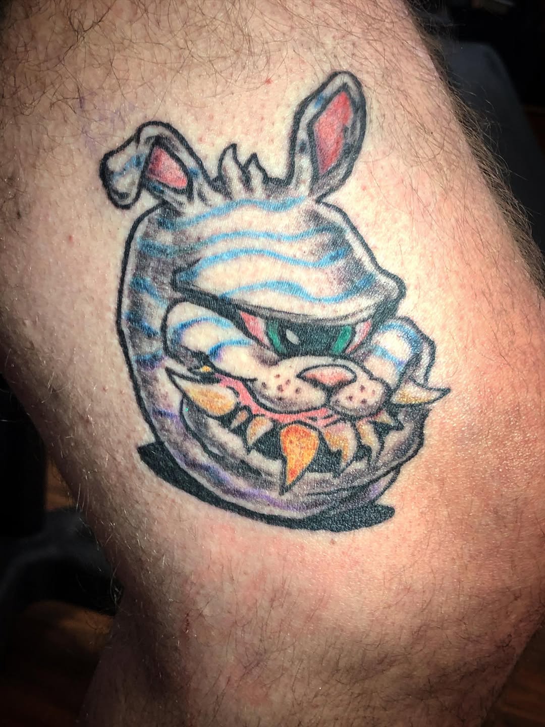 Cartoonish monster head new school tattoo on the thigh by Dharm, Denver, Colorado