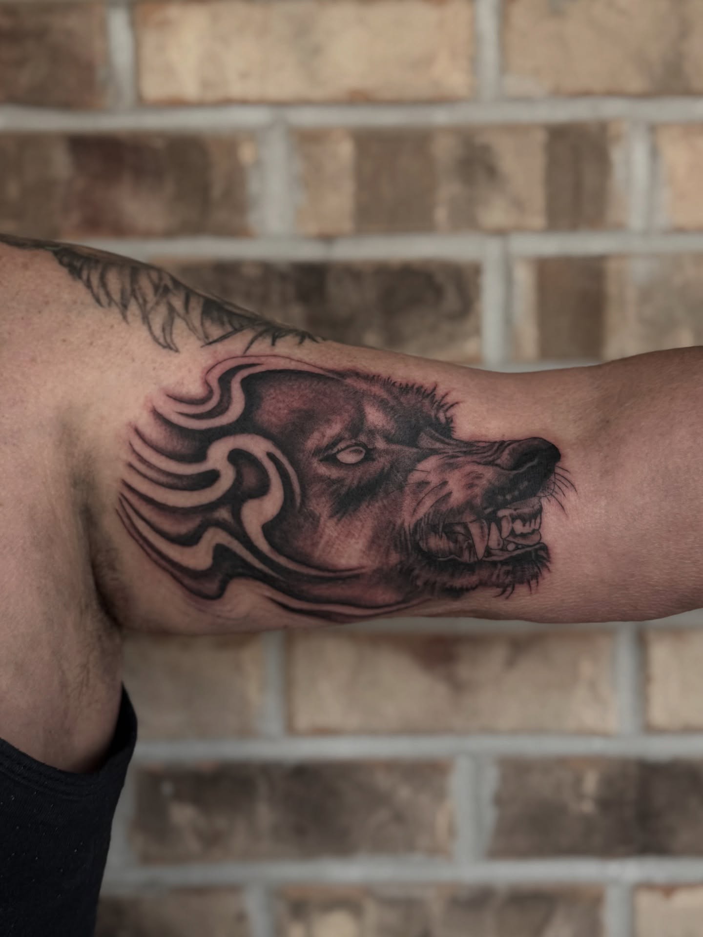Wolf realism tattoo on the forearm by Storm