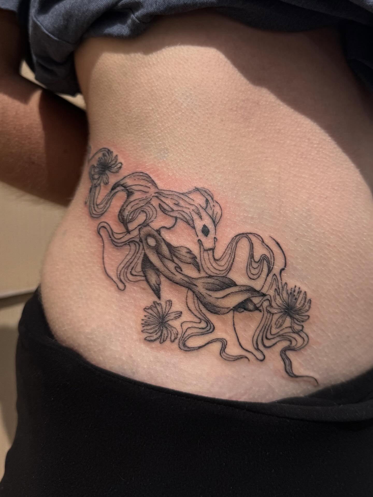 Octopus and flowers black and grey tattoo on the ribs by Jocelyne ♡