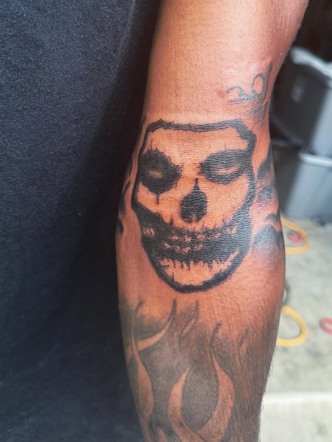 Skull with flames dark art tattoo on the forearm by ๐ฆ