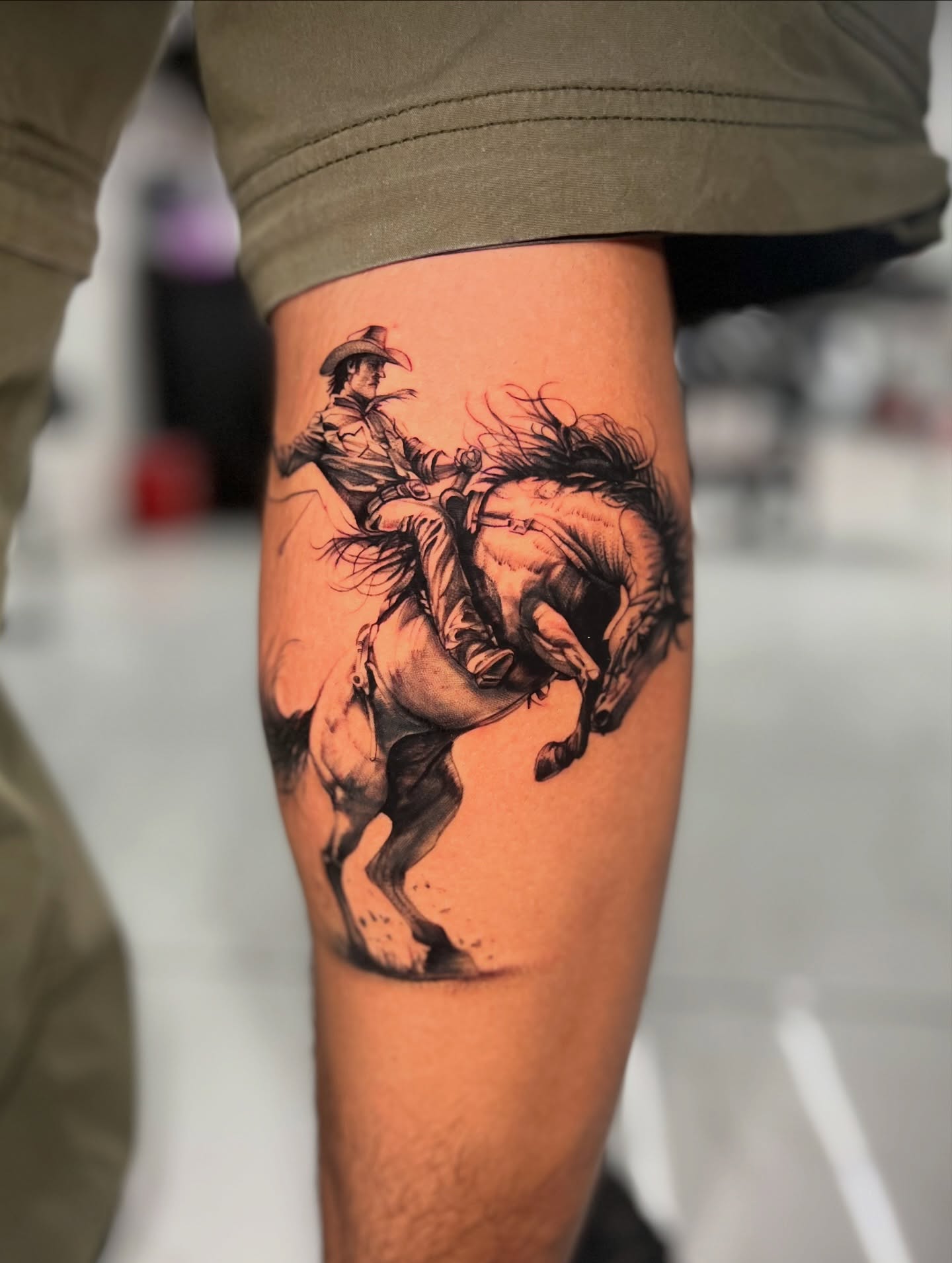 Cowboy riding horse realism tattoo on the thigh by Bay Area Tattoo Artist