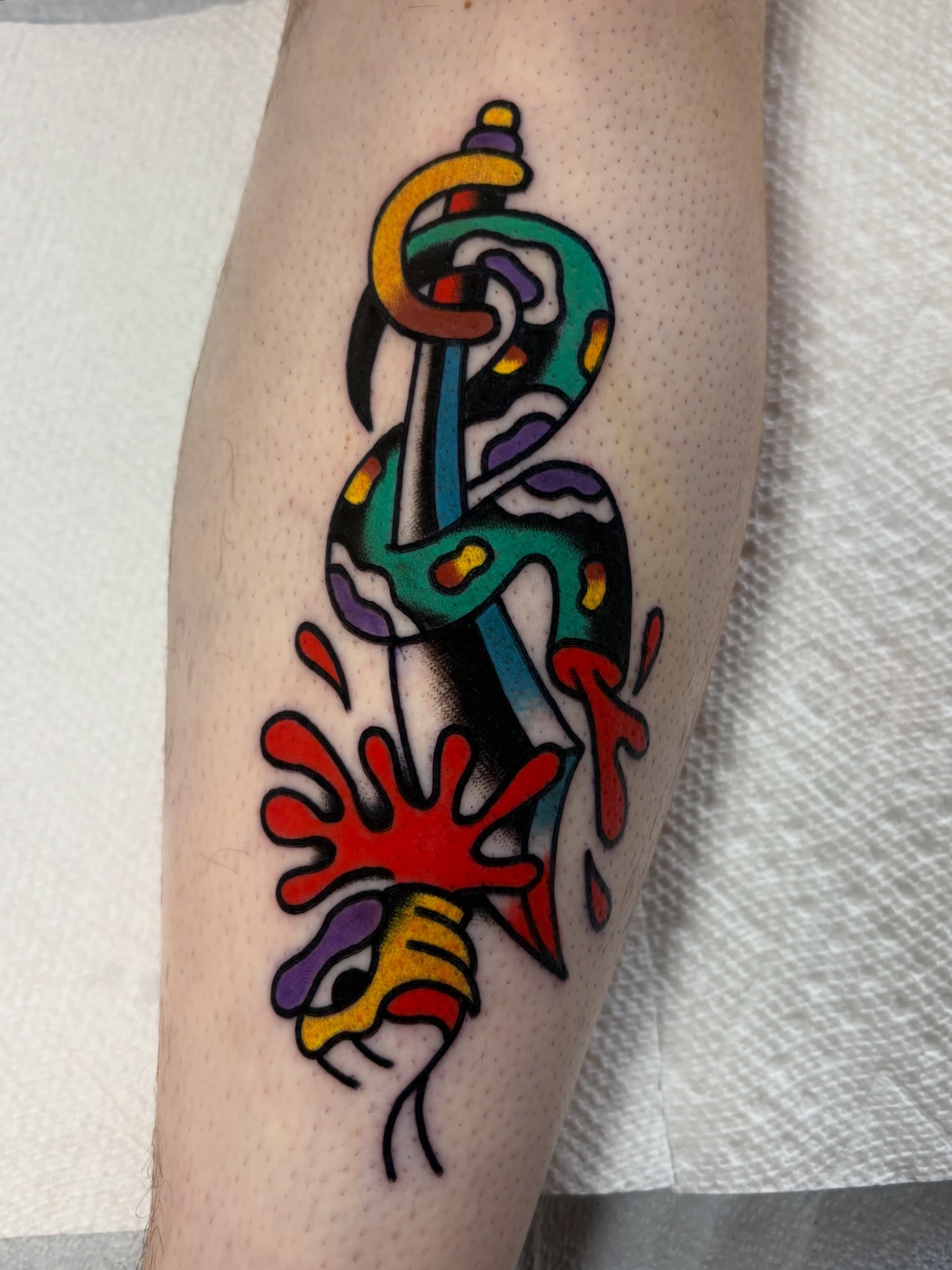 Abstract design new school tattoo on the forearm by Traditional Tattooing
