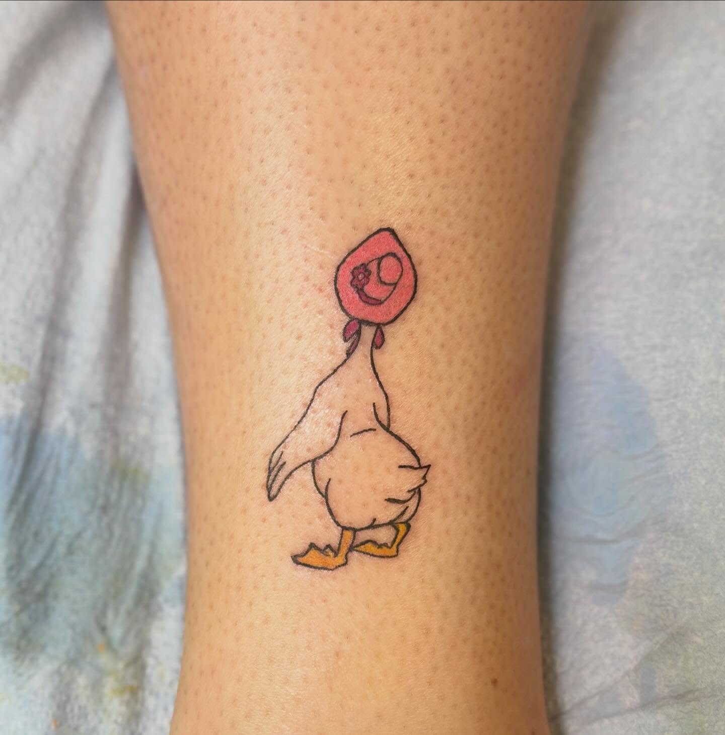 Duck with hat illustrative tattoo on the forearm by Natalie Jade Shupe