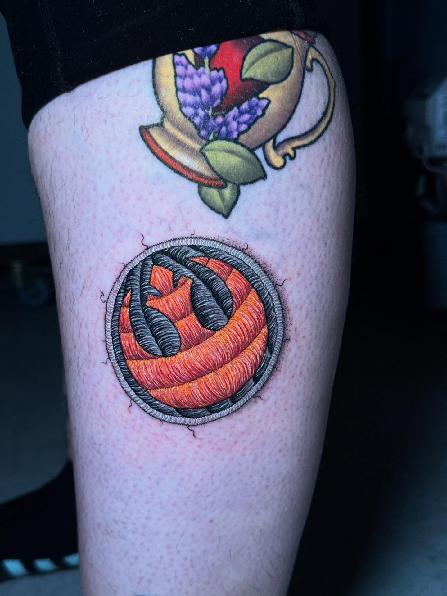 Ball of yarn realism tattoo on the leg by Max