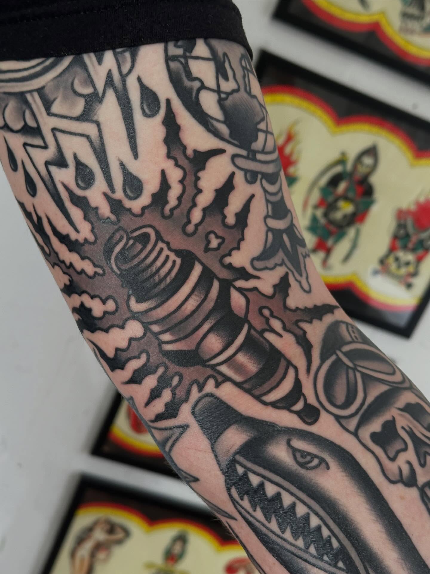 Motorcycle engine American traditional tattoo on the forearm by Steve Pearson