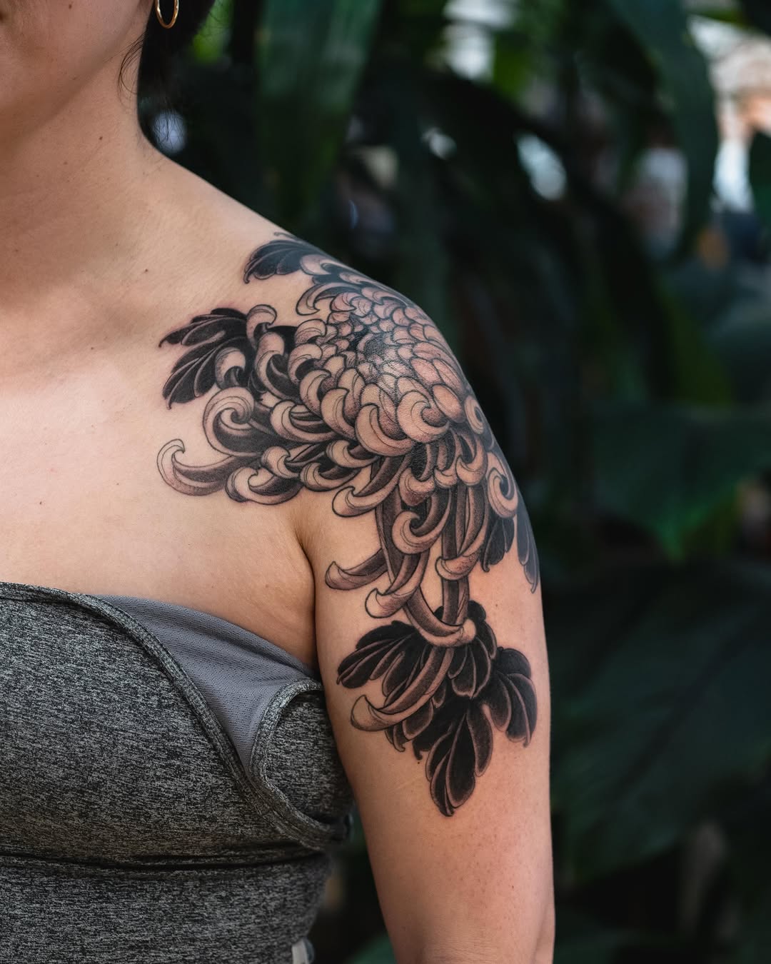 Chrysanthemum flower Japanese tattoo on the shoulder by Matt Leibo, San Francisco, California
