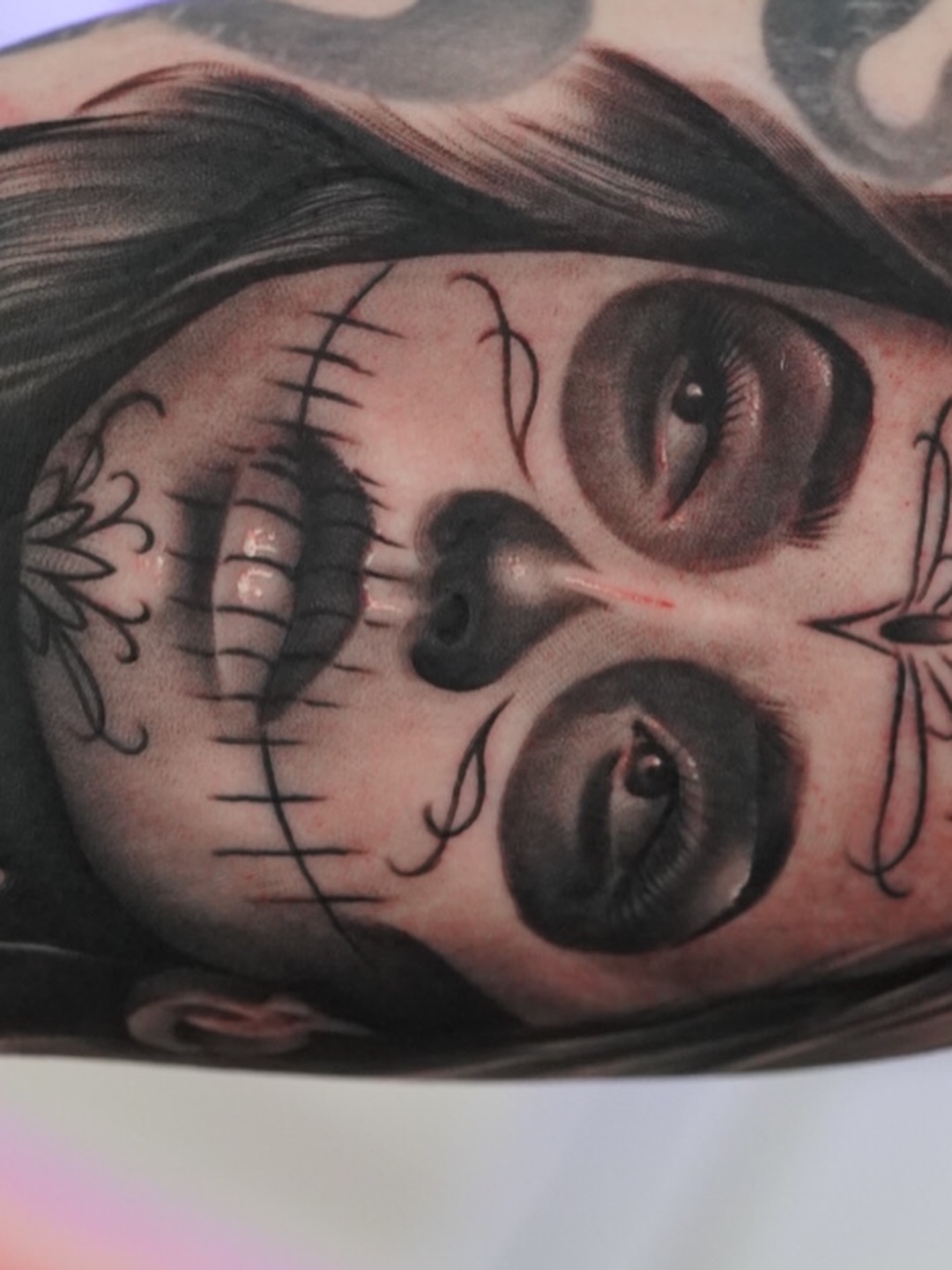 Sugar skull realism tattoo on the forearm by Luis Rodriguez