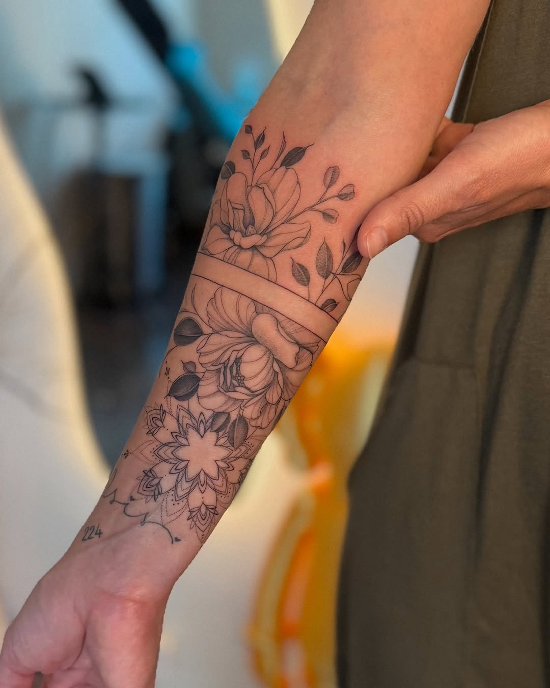Floral and mandala design dotwork tattoo on the forearm by Daniel Montoya, Charlotte, North Carolina