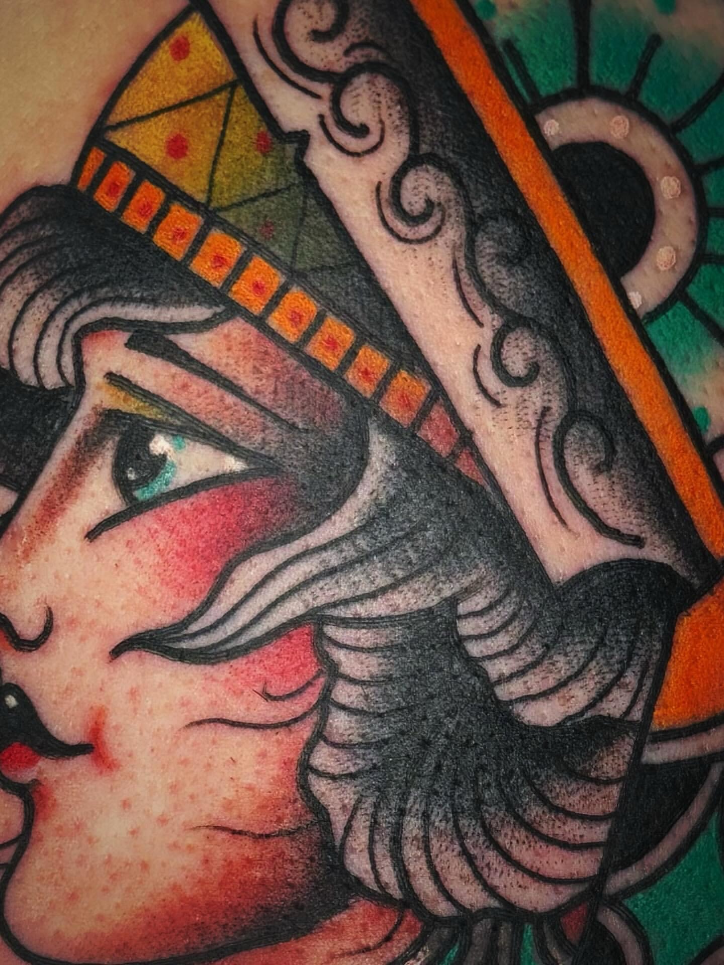 Woman with fish American traditional tattoo on the forearm by Mikey Sarratt