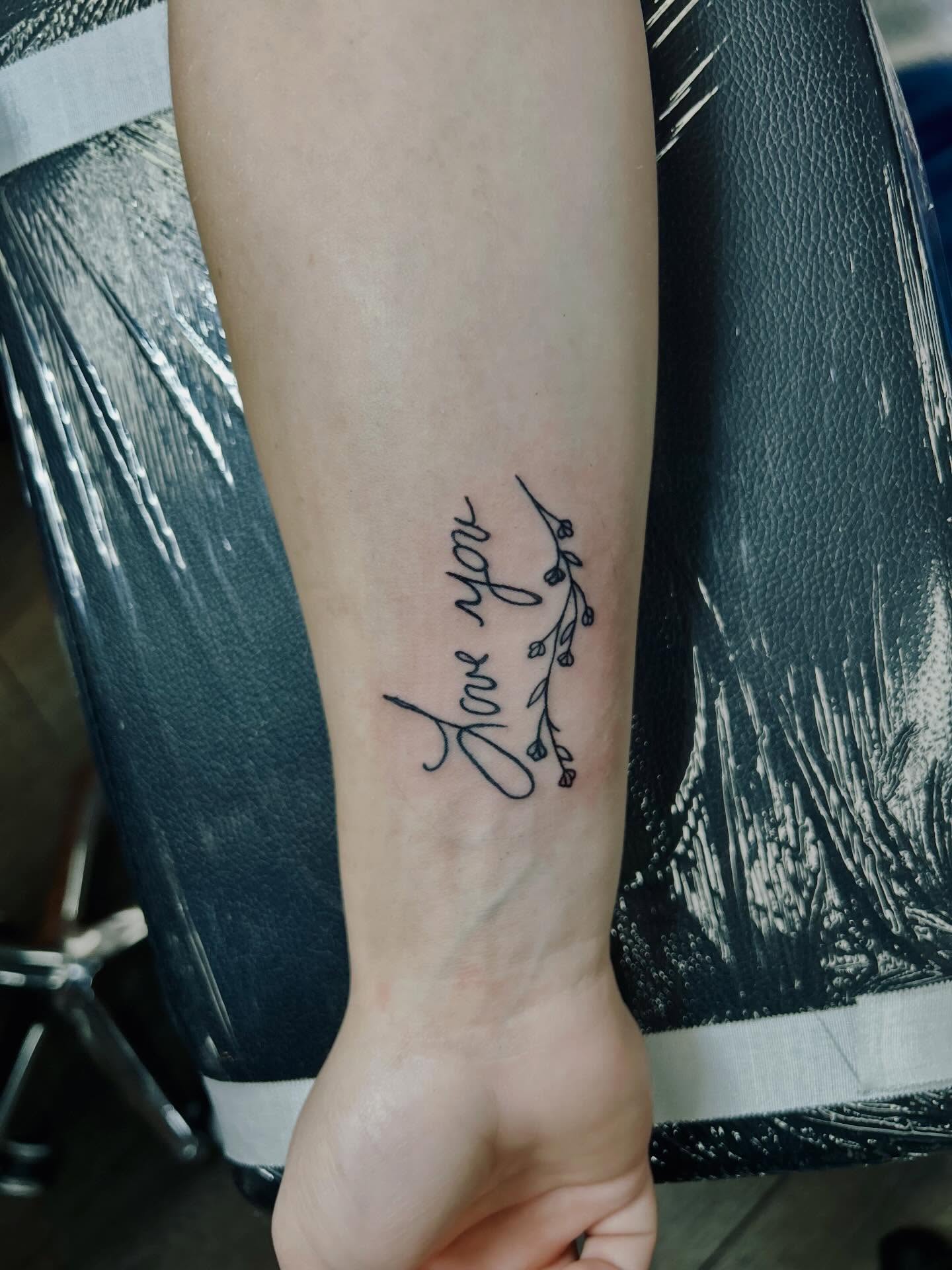Love you fine line tattoo on the forearm by Bjorn Bjornstad, Dubuque, Iowa