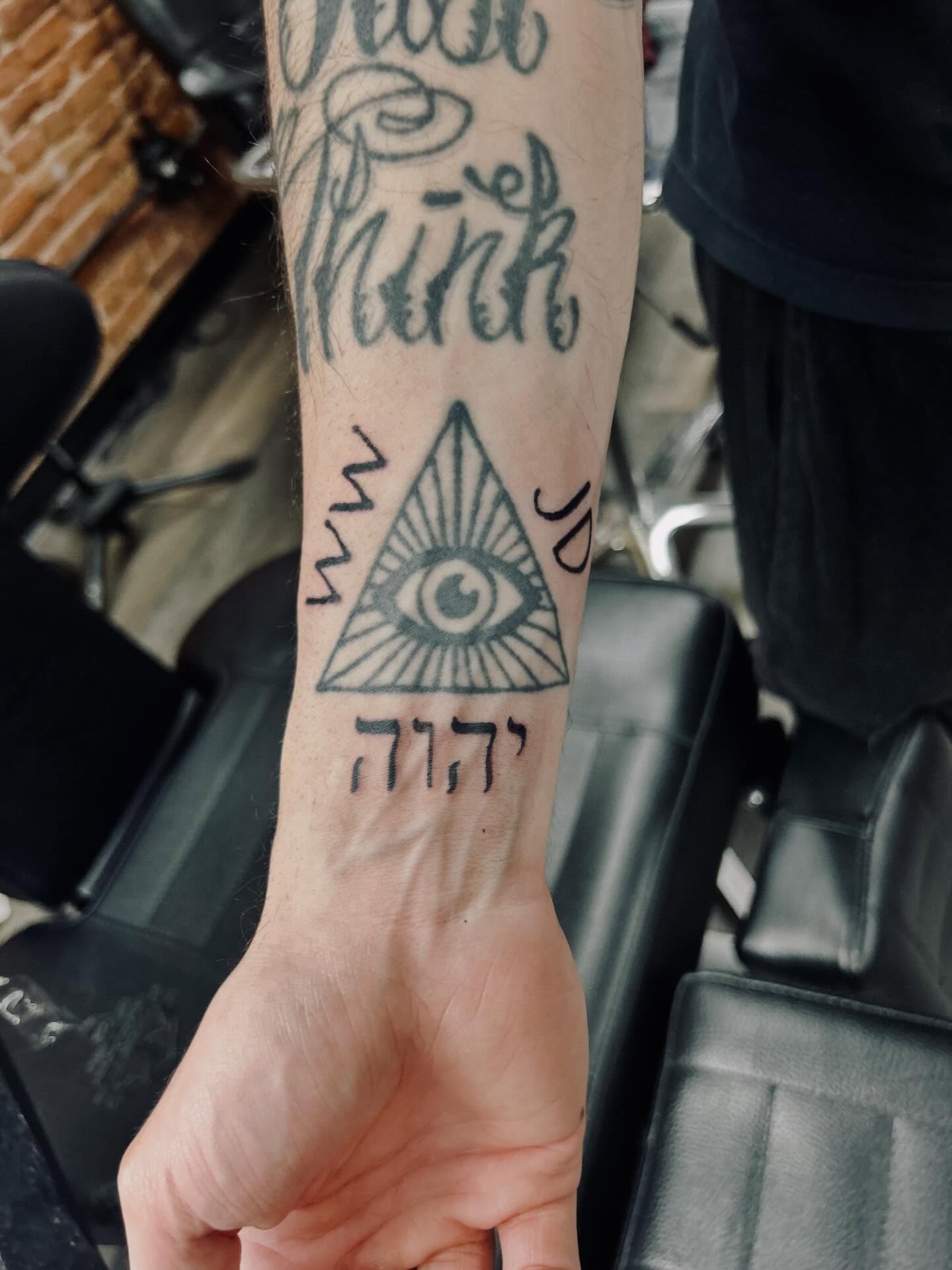 Eye within triangle geometric tattoo on the forearm by Bjorn Bjornstad, Dubuque, Iowa