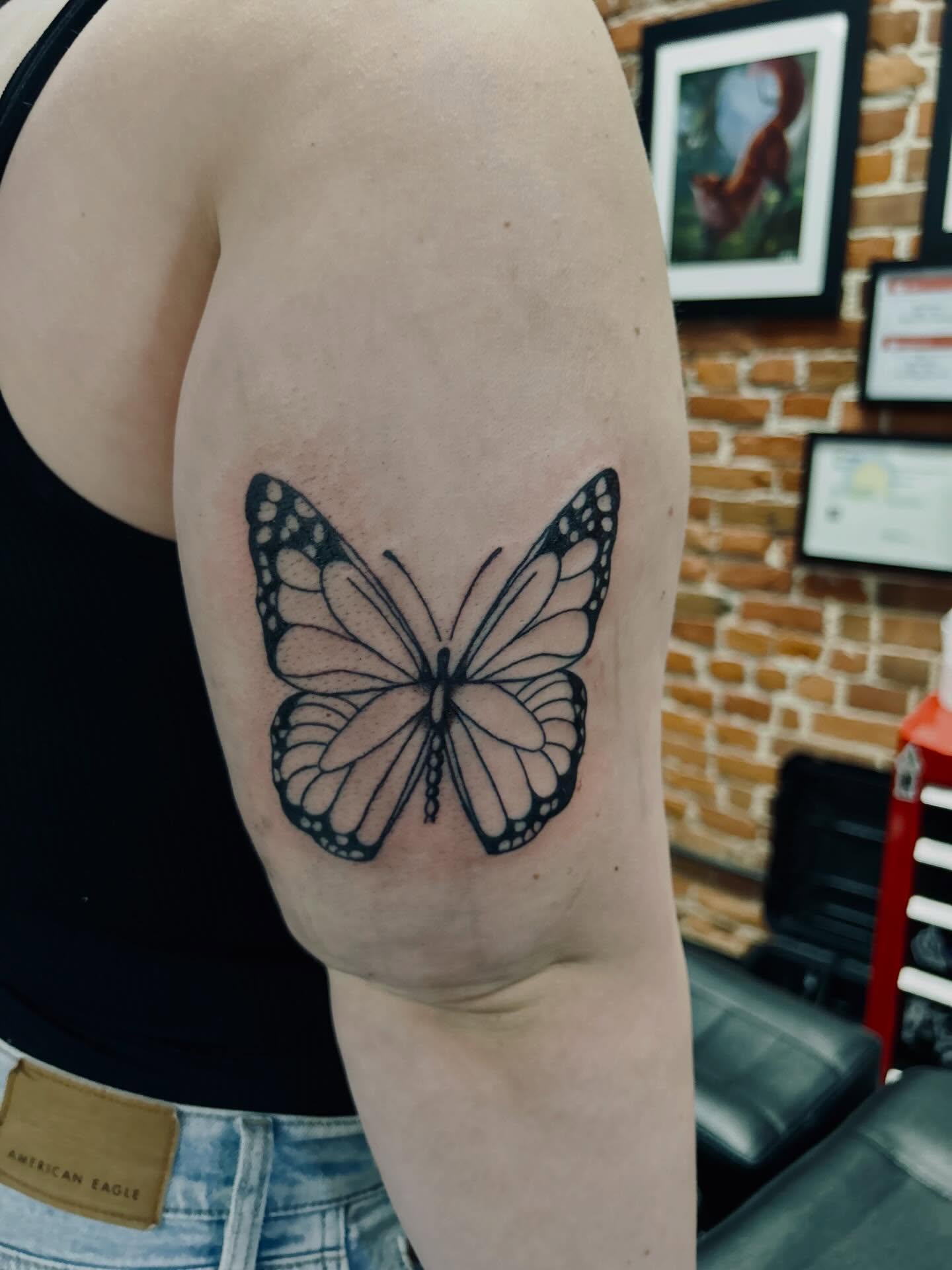 Butterfly black and grey tattoo on the forearm by Bjorn Bjornstad, Dubuque, Iowa