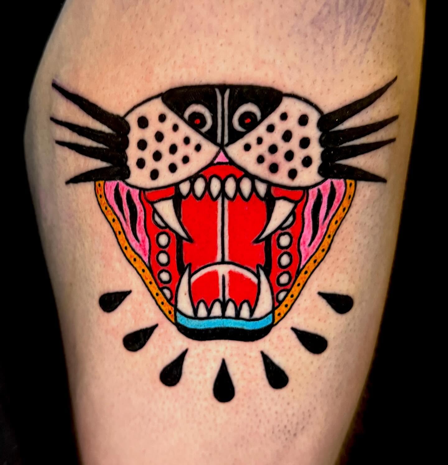 Panther head American traditional tattoo on the thigh by Henry Bubula, Minneapolis, Minnesota