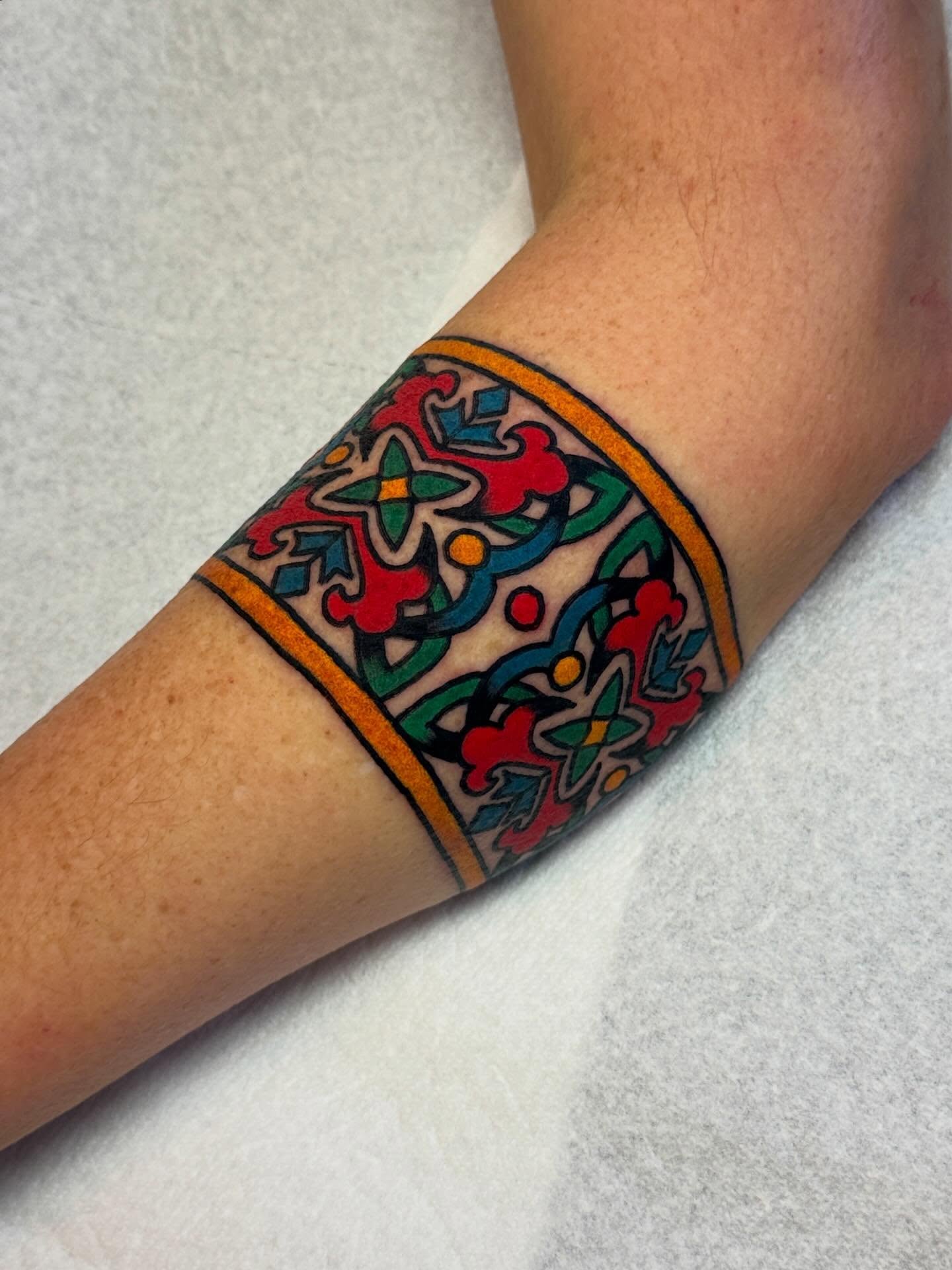 Floral pattern ornamental tattoo on the forearm by Britt Kuechenmeister, Culver City, California
