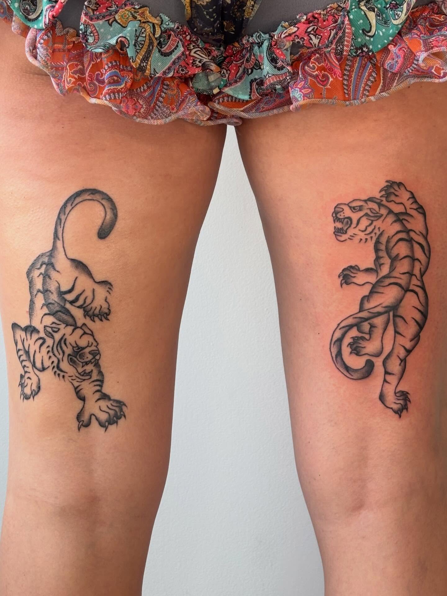 Tiger black and grey tattoo on the thigh by Topher Belmont