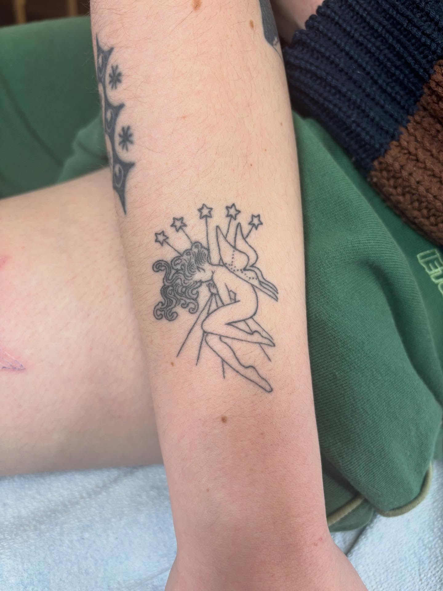 Naked fairy with stars black and grey tattoo on the forearm by dayton skuse, Portland, Oregon