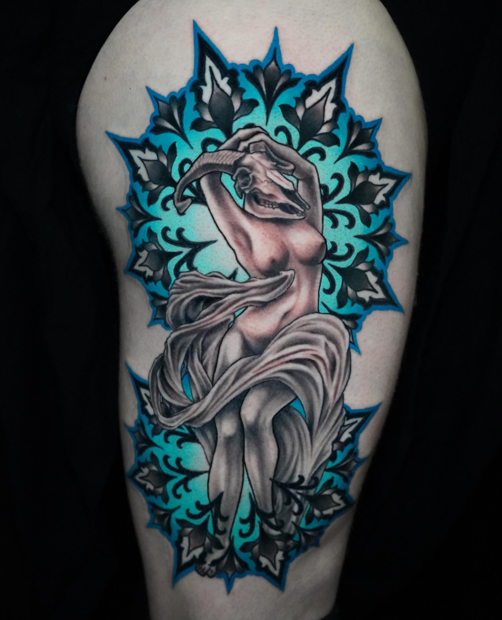 Woman with scarf realism tattoo on the forearm by Gina Carlson