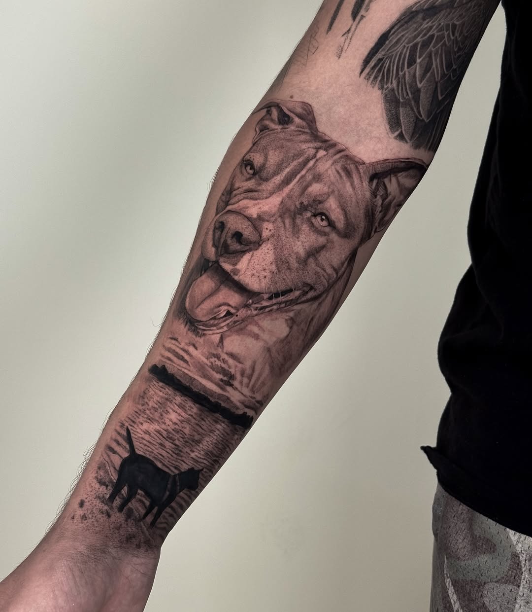 Pitbull dog and landscape realism tattoo on the forearm by Brisia Cisneros